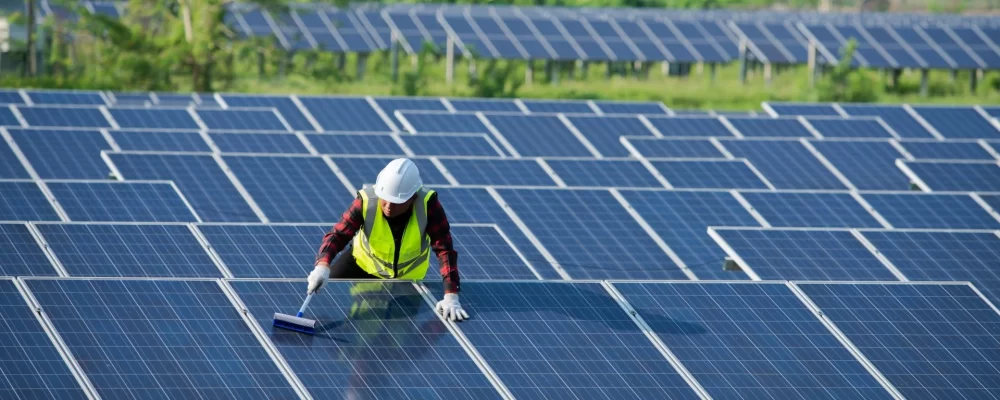 cleaning-solar-panels-by-workers-in-uniform-safety-2022-11-02-17-35-33-utc