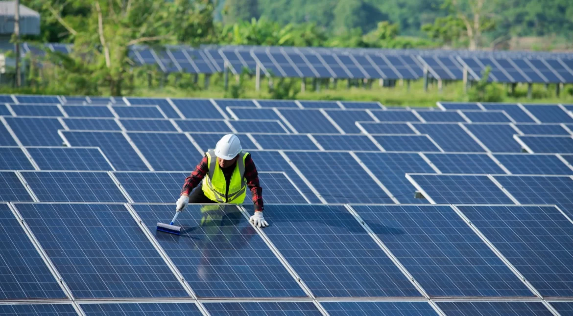 cleaning solar panels by workers in uniform safety 2022 11 02 17 35 33 utc