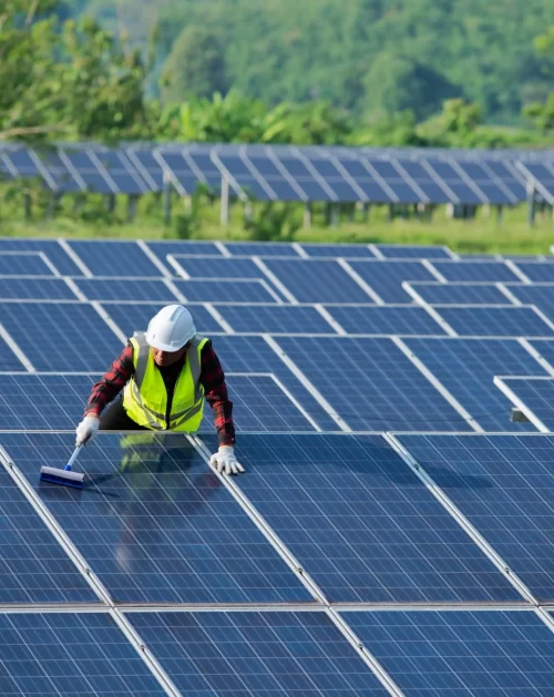 cleaning-solar-panels-by-workers-in-uniform-safety-2022-11-02-17-35-33-utc